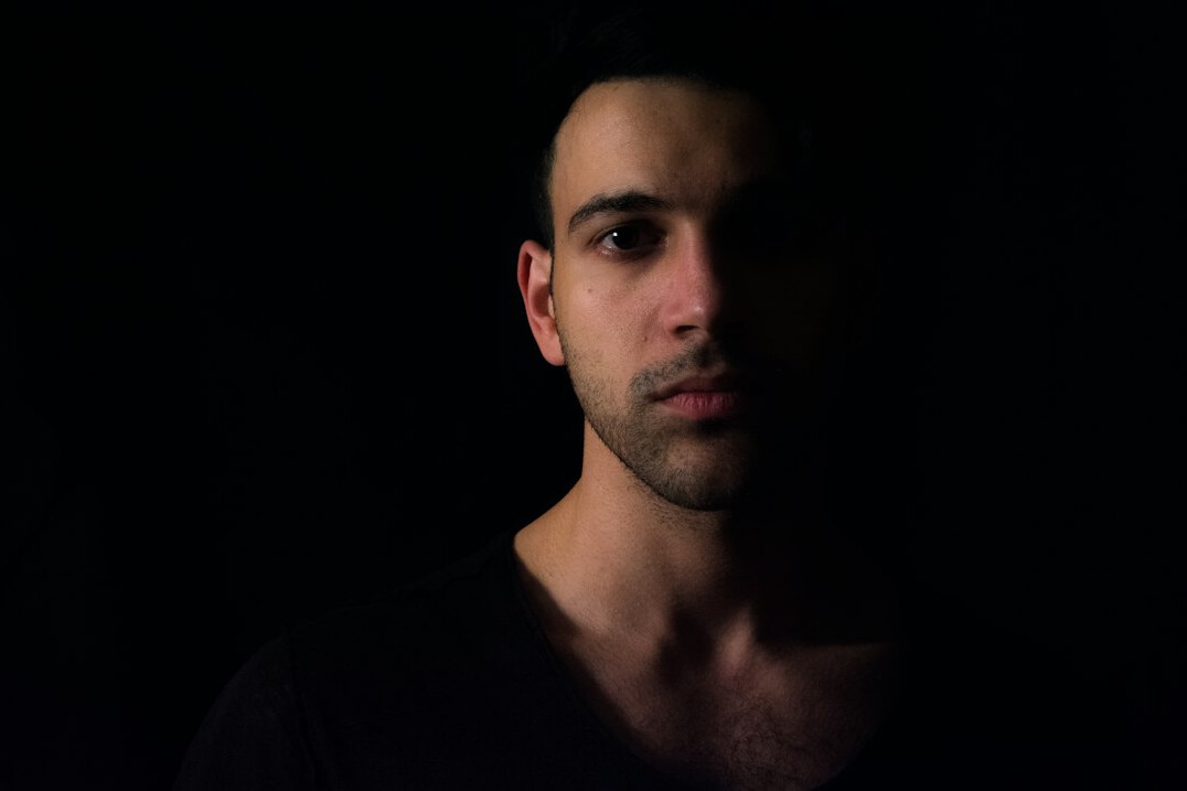Portrait of a man with short hair and stubble