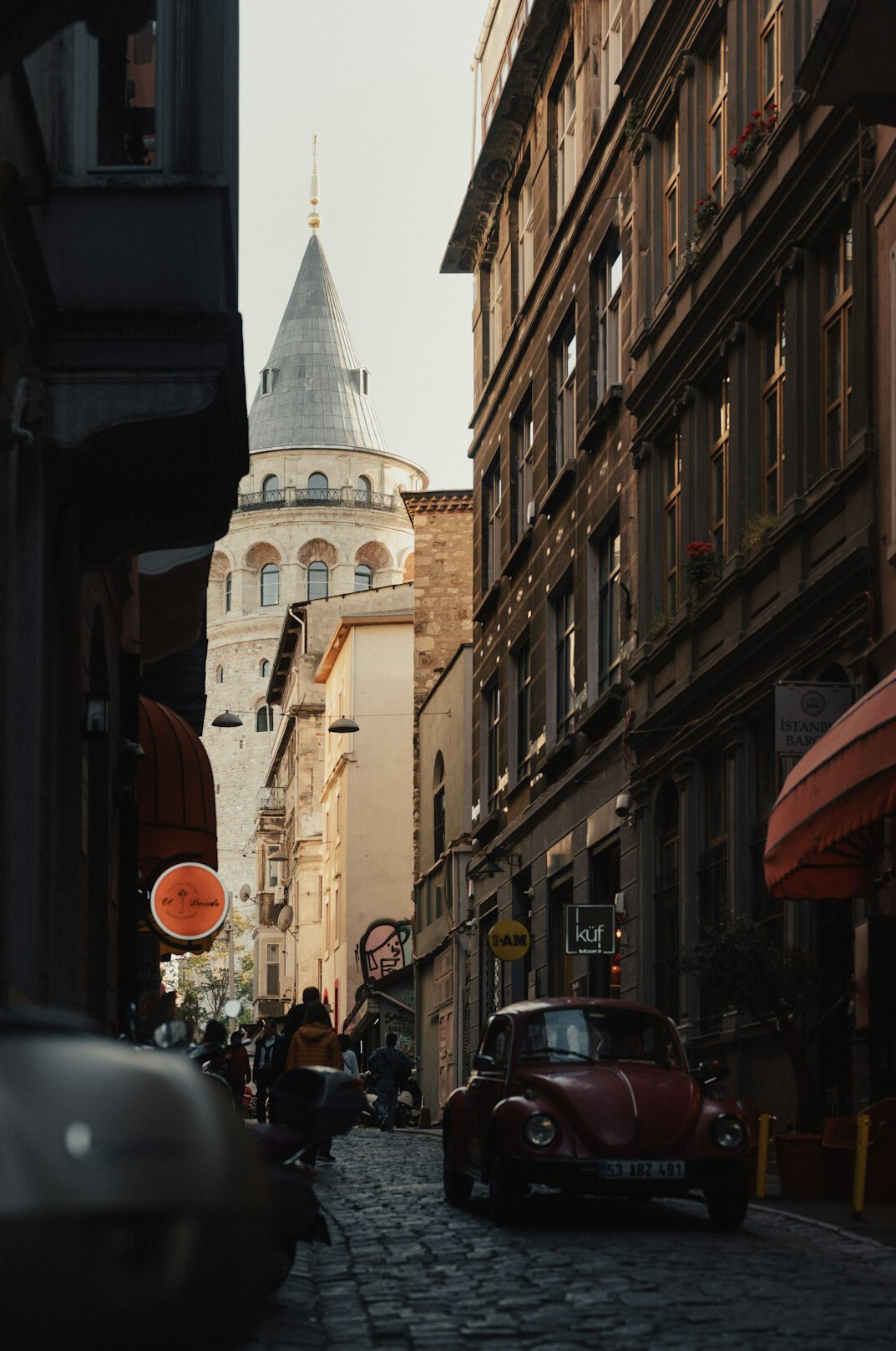 Istanbul city street scene with the Galata Tower in the distance